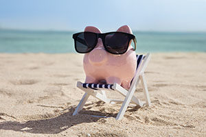Piggy Bank On Deckchair With Sunglasses